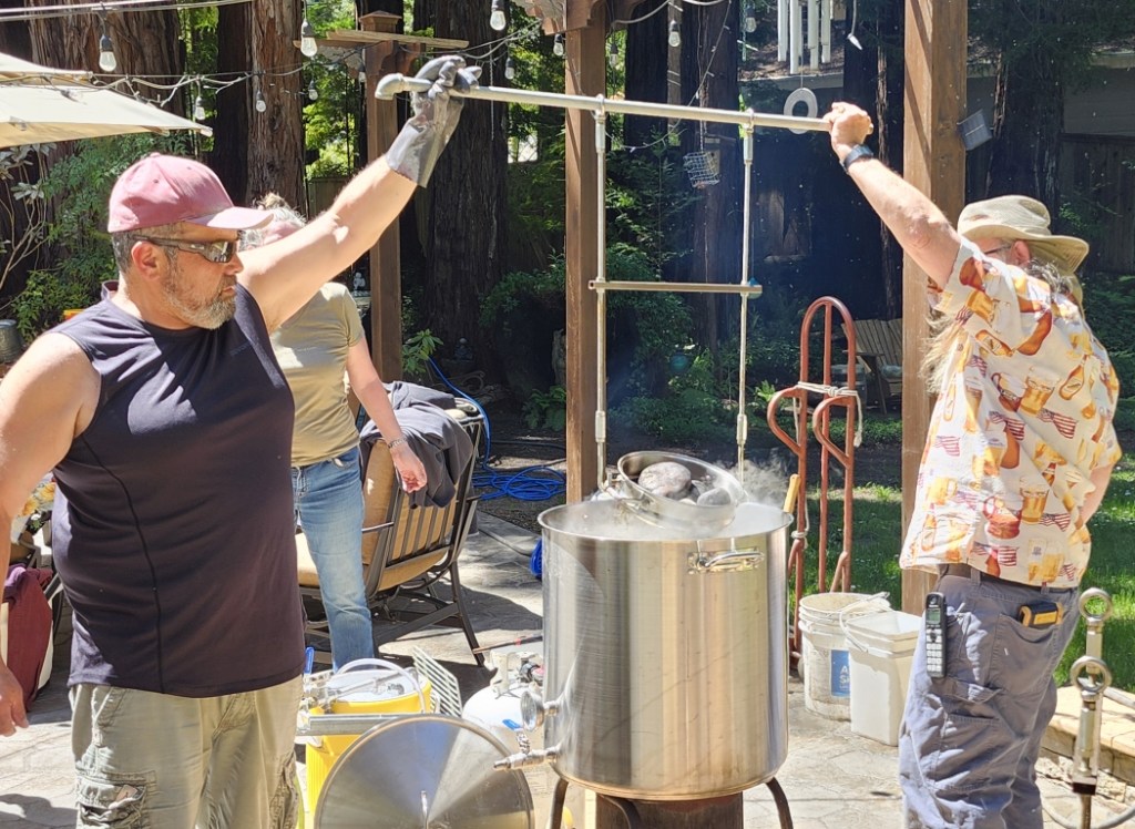 Loading rocks into the brewpot.